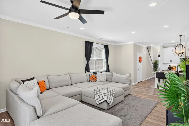 a living room with furniture and a rug