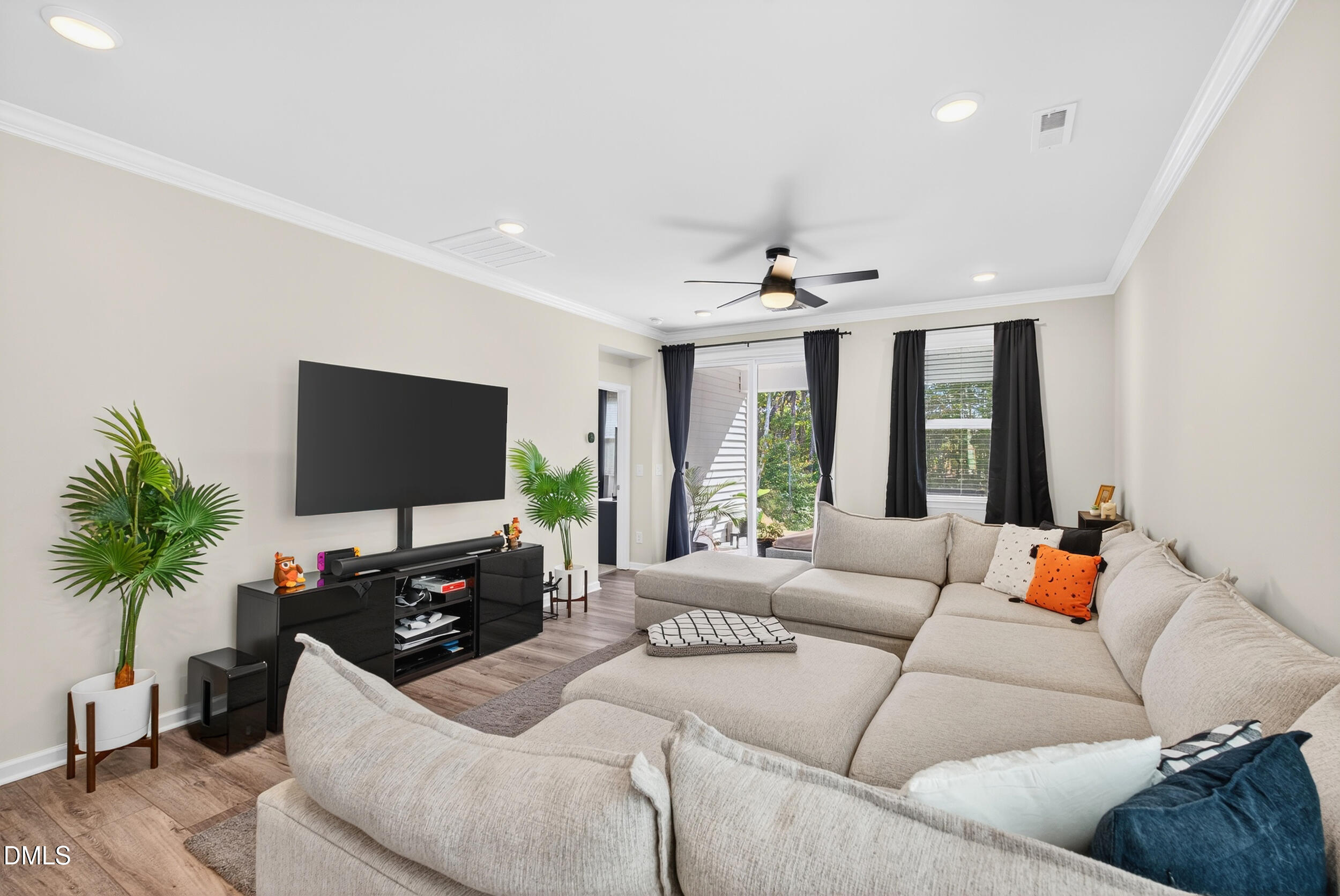 143 Umbrella Way Garner, NC 27529 - Photo 7 of 31 a living room with furniture and a flat screen tv
