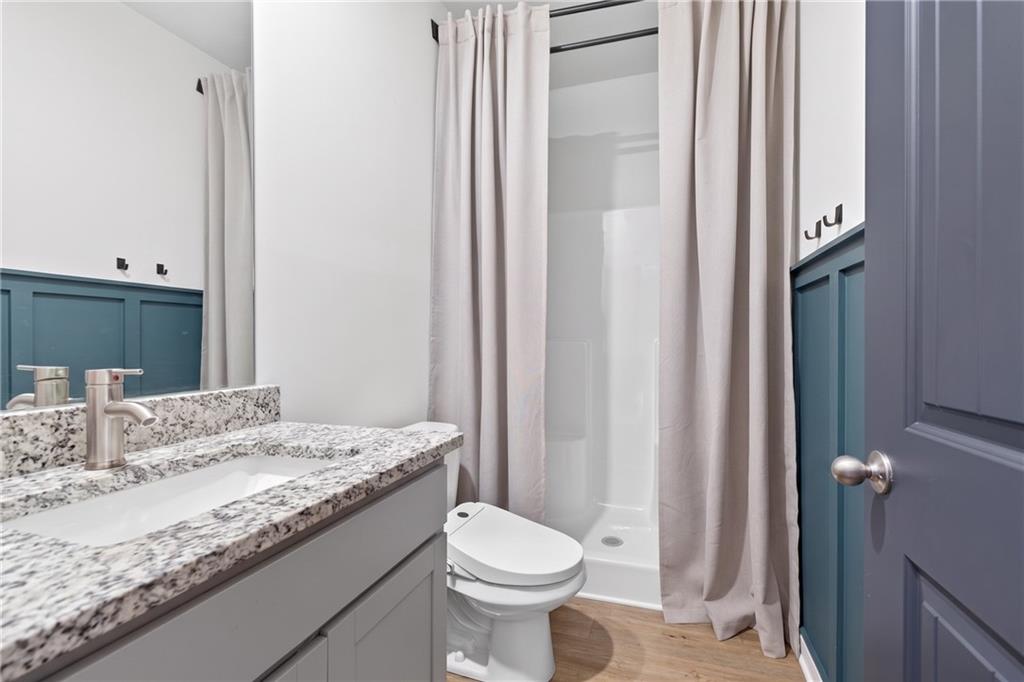 480 Overlook Road Covington, GA 30014 - Photo 13 of 20 a bathroom with a granite countertop sink toilet and mirror