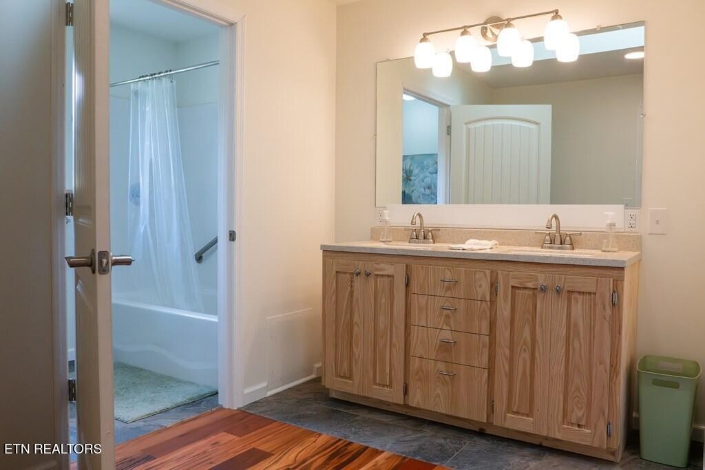 1518 Cummingsville And Sparkman Road Doyle, TN 38559 - Photo 34 of 58 a bathroom with a sink mirror and a shower