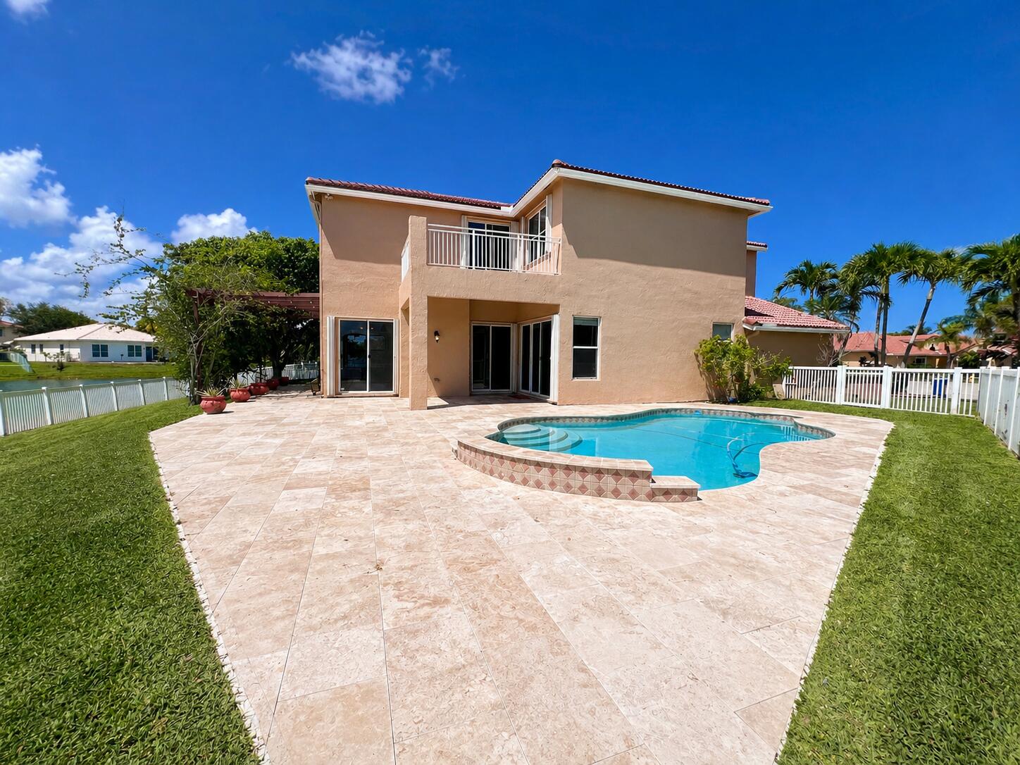 13196 Southwest 29th Street Miramar, FL 33027 - Photo 39 of 71 a front view of a house with a yard table and chairs
