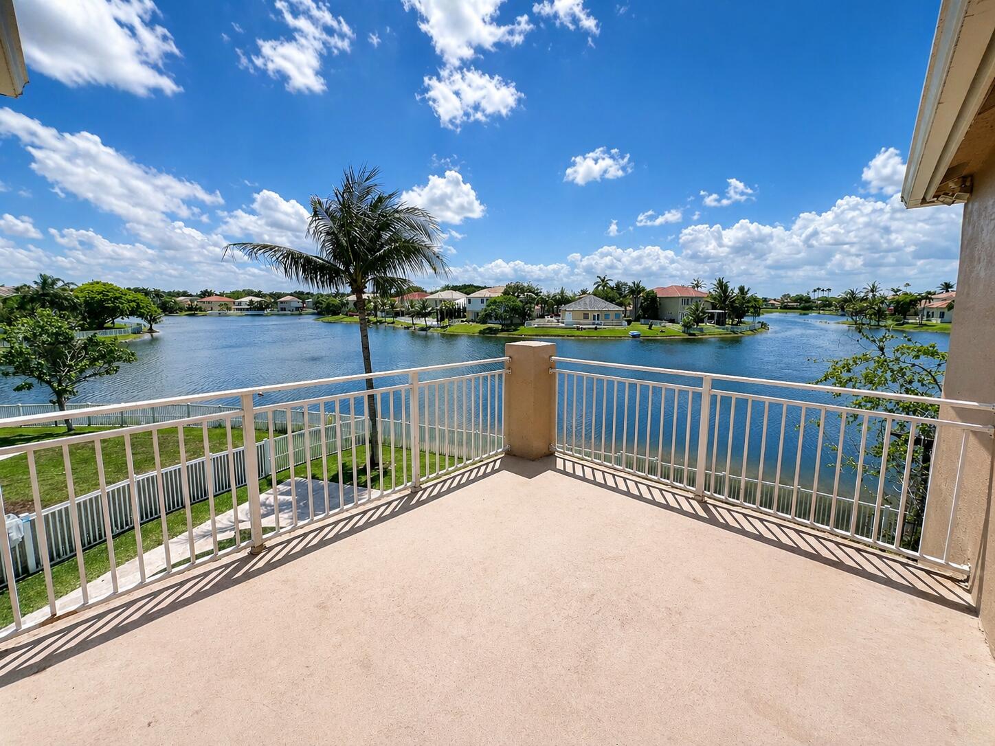 13196 Southwest 29th Street Miramar, FL 33027 - Photo 4 of 71 a view of balcony with wooden floor & fence