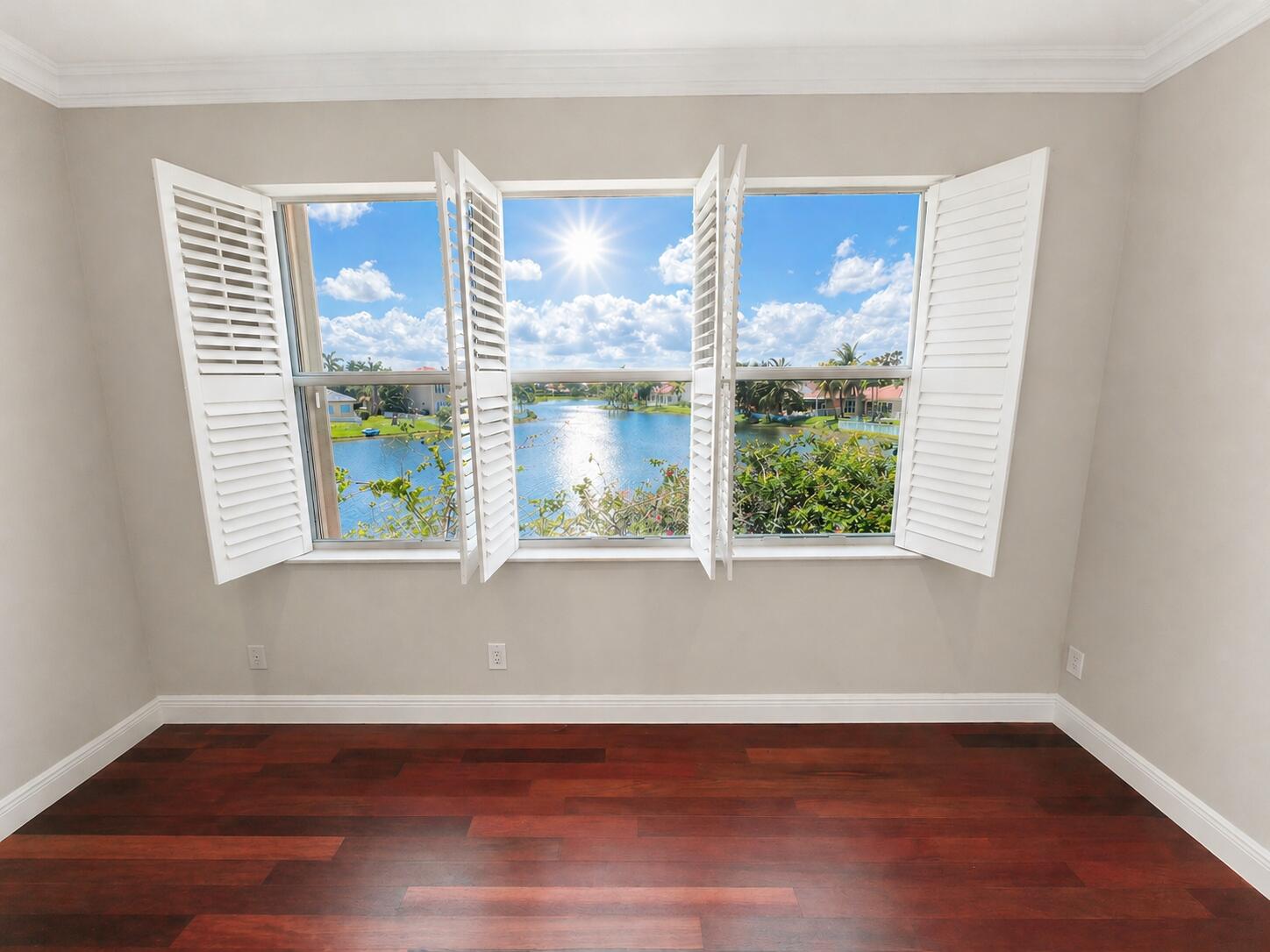 13196 Southwest 29th Street Miramar, FL 33027 - Photo 61 of 71 a view of an empty room with wooden floor and a window