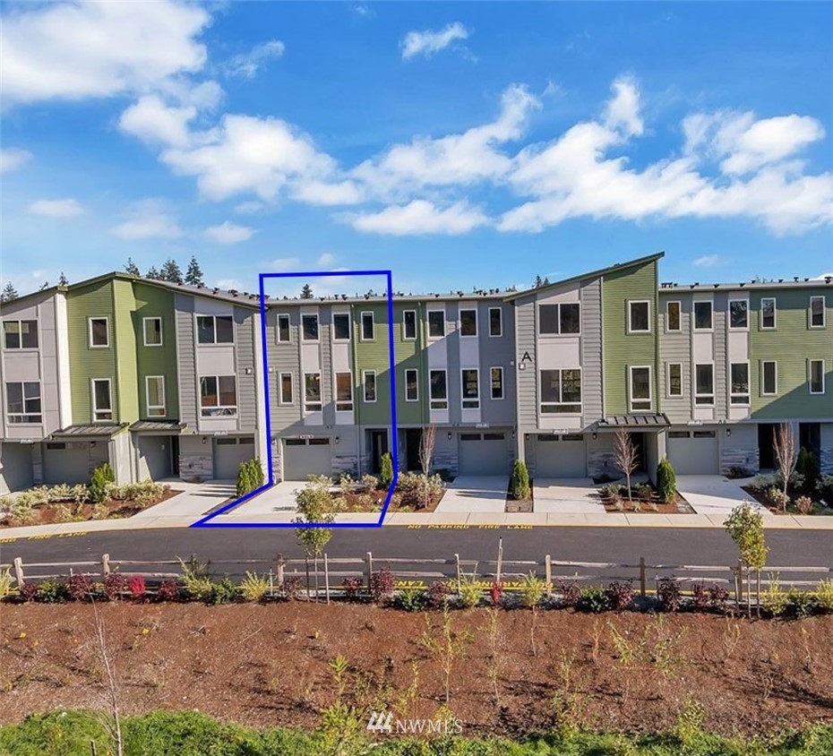 a view of a building with a fountain and a bench