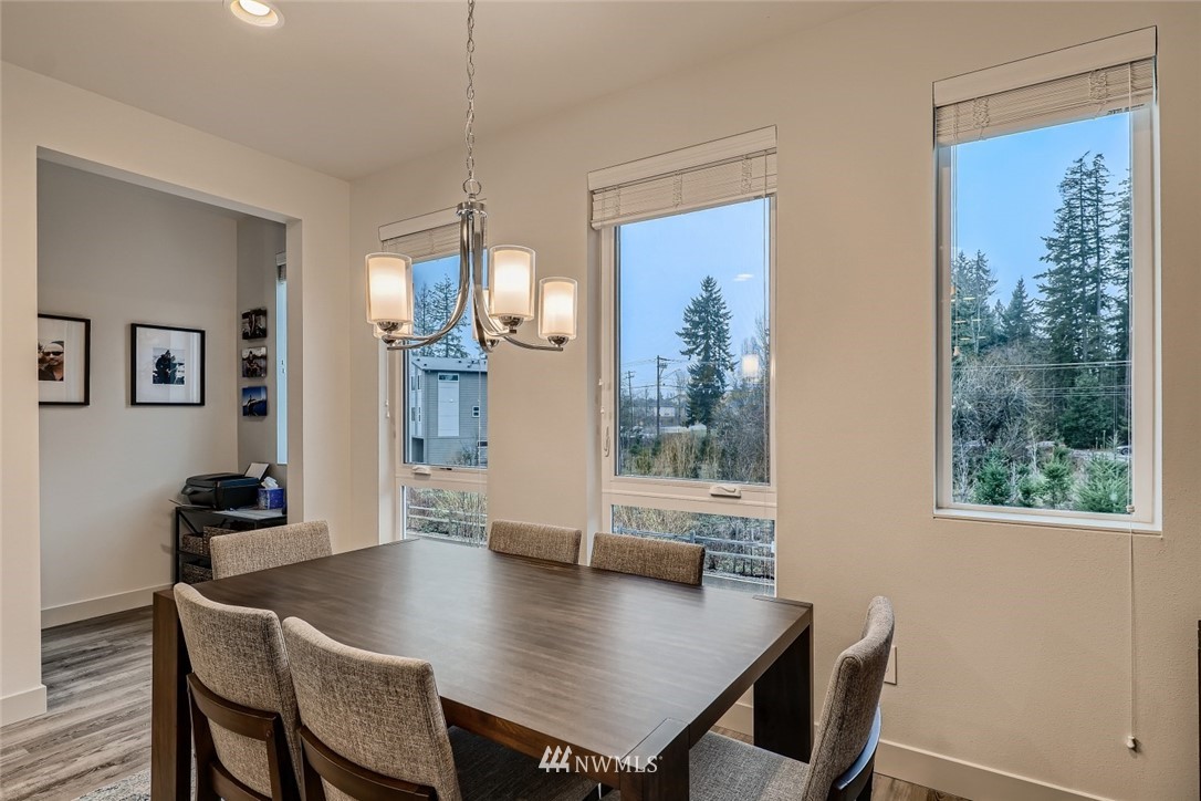 17905 35th Avenue Southeast, Unit A3 Bothell, WA 98012 - Photo 11 of 35 a view of a dining room with furniture window and wooden floor