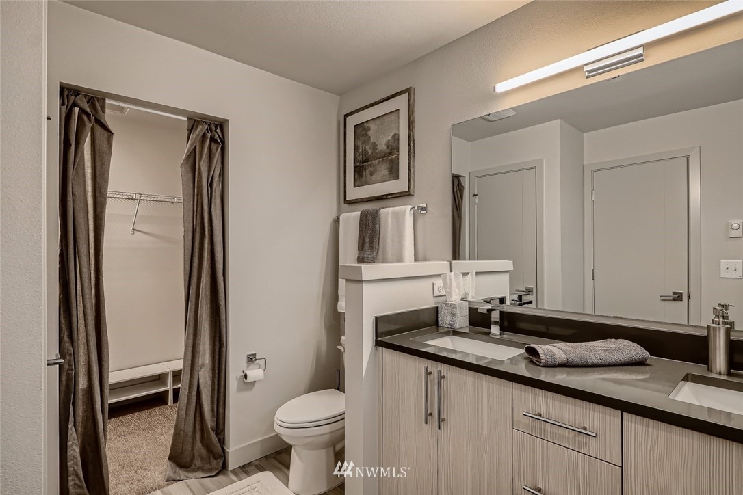 17905 35th Avenue Southeast, Unit A3 Bothell, WA 98012 - Photo 18 of 35 a bathroom with a granite countertop sink toilet and shower
