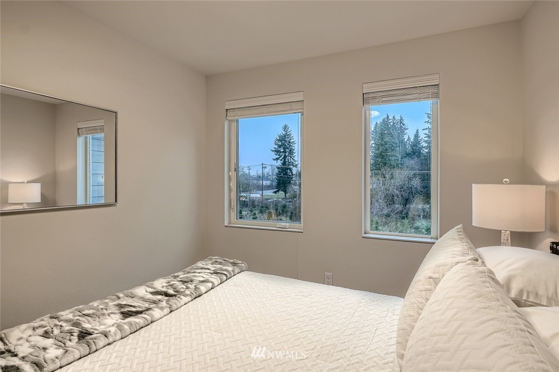 17905 35th Avenue Southeast, Unit A3 Bothell, WA 98012 - Photo 19 of 35 a bedroom with a bed and a window