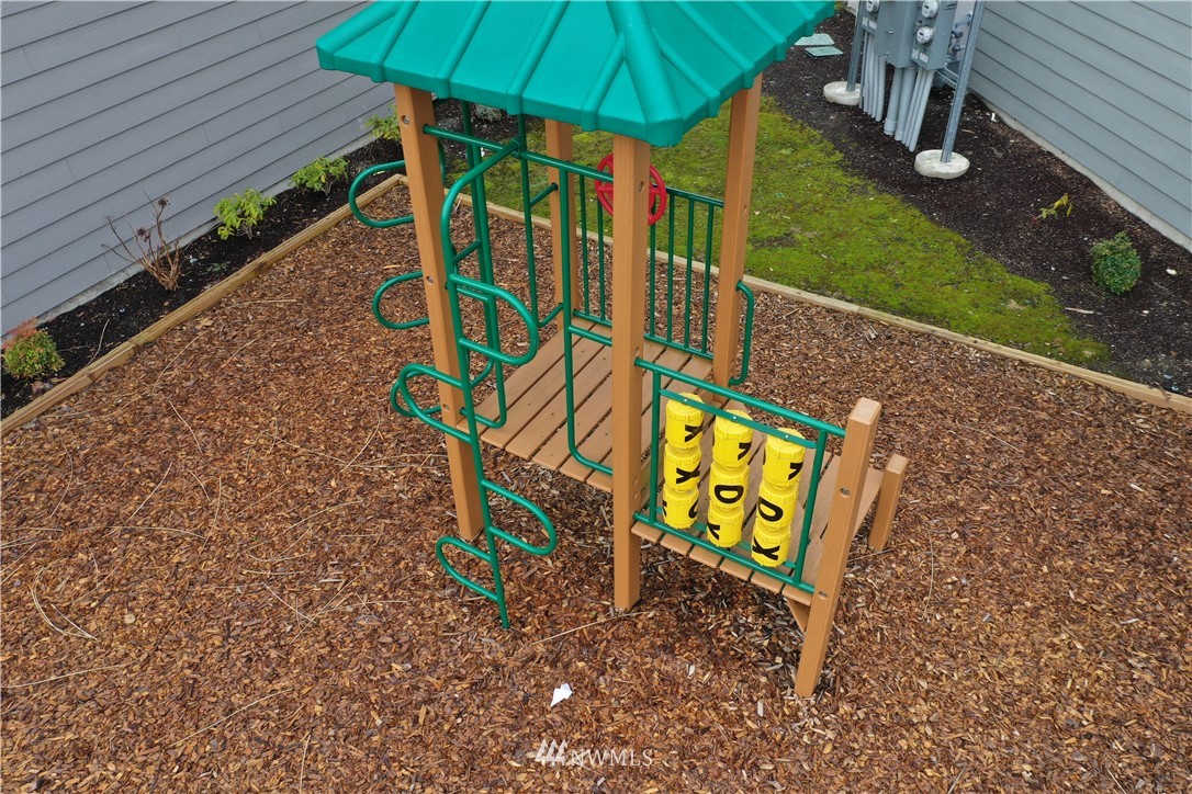 17905 35th Avenue Southeast, Unit A3 Bothell, WA 98012 - Photo 25 of 35 a view of an outdoor space with sign board