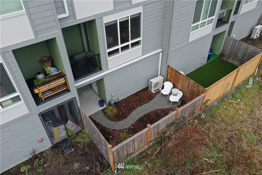 17905 35th Avenue Southeast, Unit A3 Bothell, WA 98012 - Photo 29 of 35 a picture of a table and chairs in the balcony