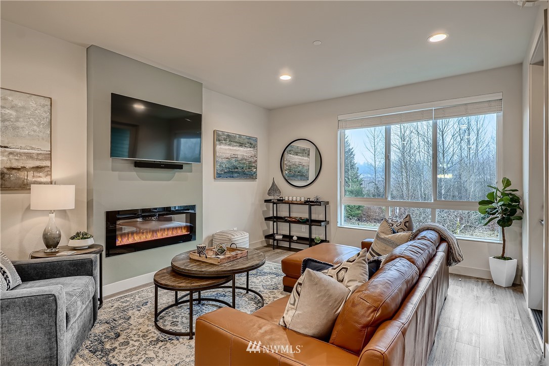 17905 35th Avenue Southeast, Unit A3 Bothell, WA 98012 - Photo 3 of 35 a living room with furniture and a flat screen tv