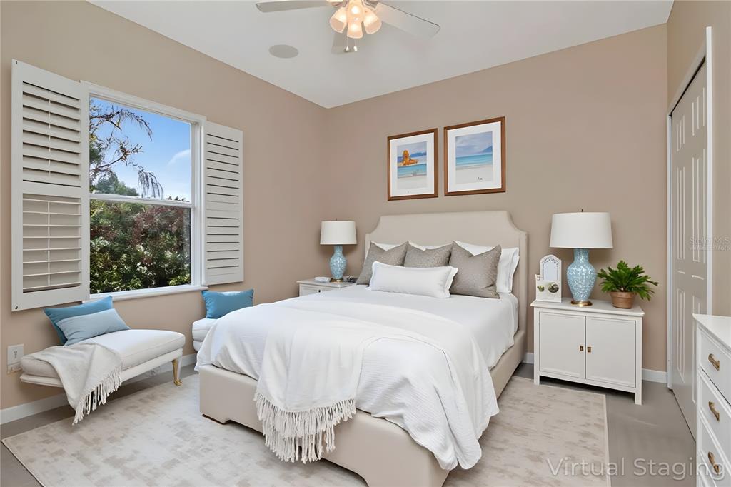 1835 Regal Mist Loop Trinity, FL 34655 - Photo 40 of 55 a bedroom with bed and a chandelier