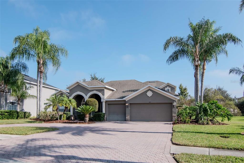 1835 Regal Mist Loop Trinity, FL 34655 - Photo 4 of 55 a front view of a house with garden