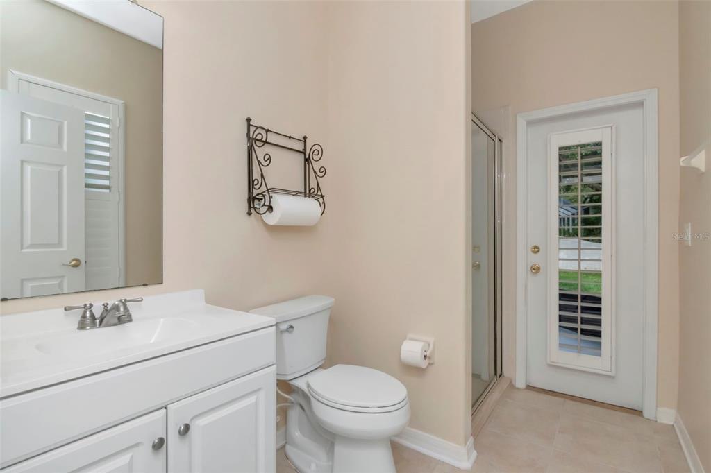 1835 Regal Mist Loop Trinity, FL 34655 - Photo 41 of 55 a bathroom with a toilet sink and mirror