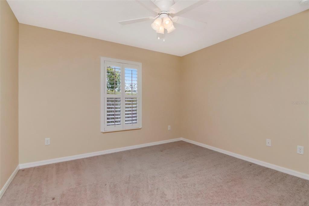 1835 Regal Mist Loop Trinity, FL 34655 - Photo 42 of 55 an empty room with a window and a fan
