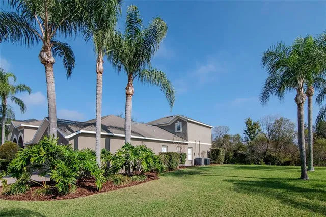an entryway with wooden floor and windows