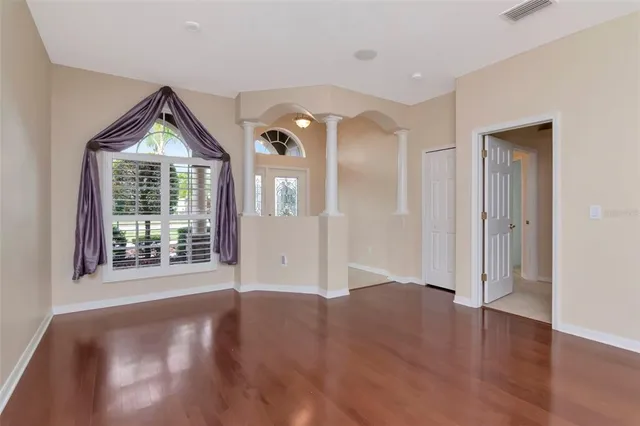 a view of a kitchen with a sink and a window