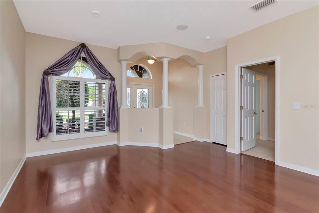 1835 Regal Mist Loop Trinity, FL 34655 - Photo 9 of 55 a view of an empty room with wooden floor and a window