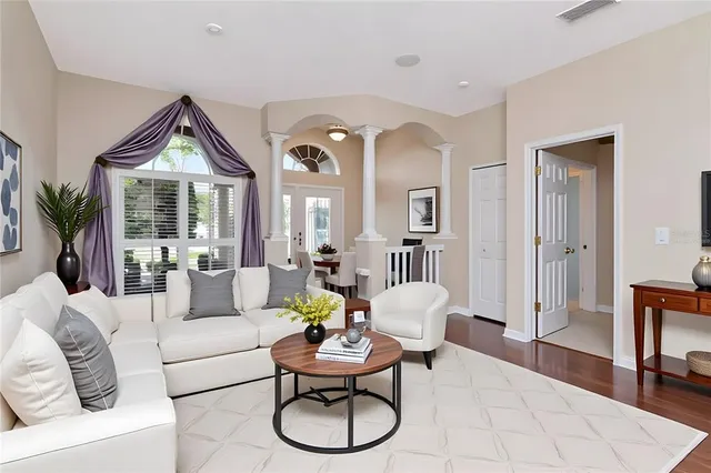 a kitchen with stainless steel appliances granite countertop a sink refrigerator and microwave