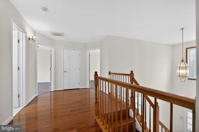 a view of hallway with wooden floor