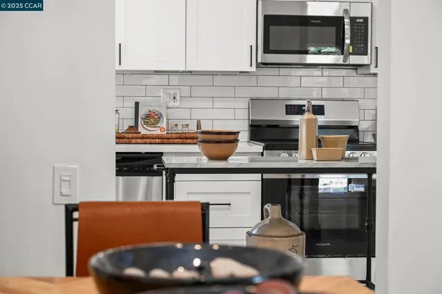 a kitchen with a sink and a window