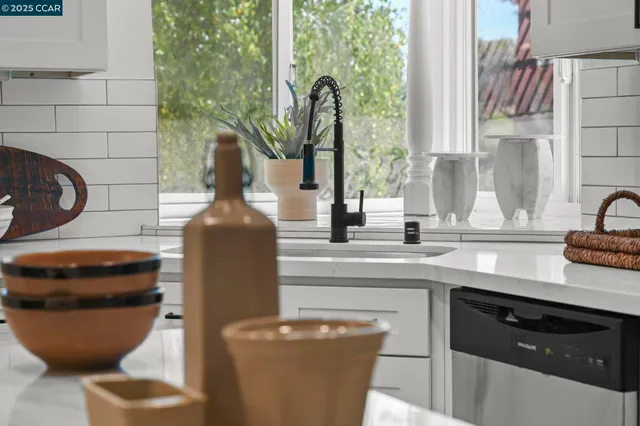 a kitchen with stainless steel appliances granite countertop a stove a microwave and cabinets