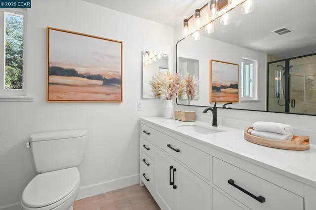 a bathroom with a glass door shower