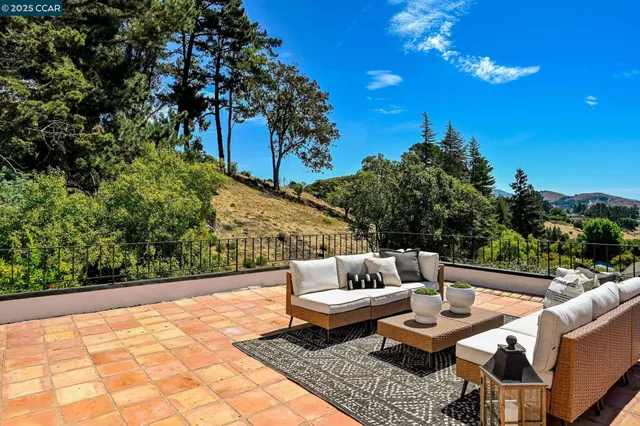 a view of a garden with an outdoor seating