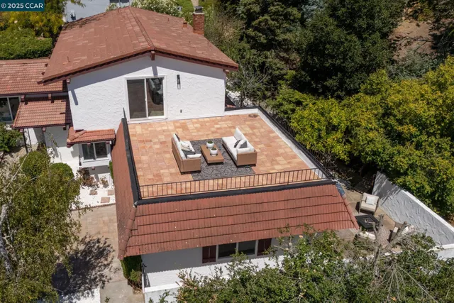 a view of a balcony with wooden floor