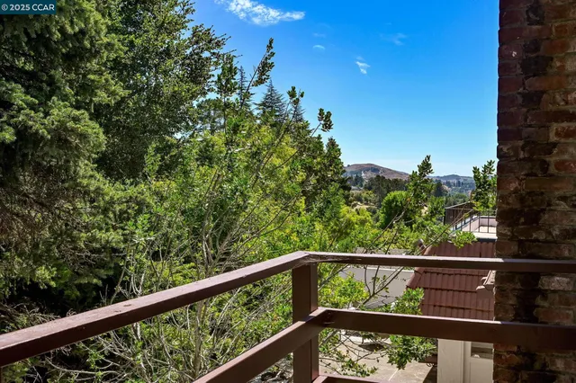 a backyard of a house with outdoor seating
