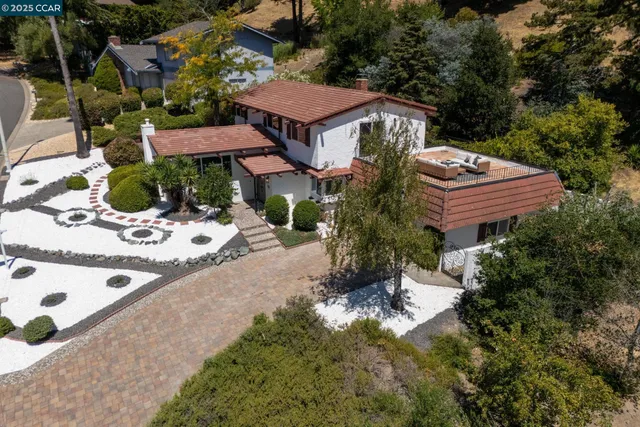 a aerial view of a house with a yard