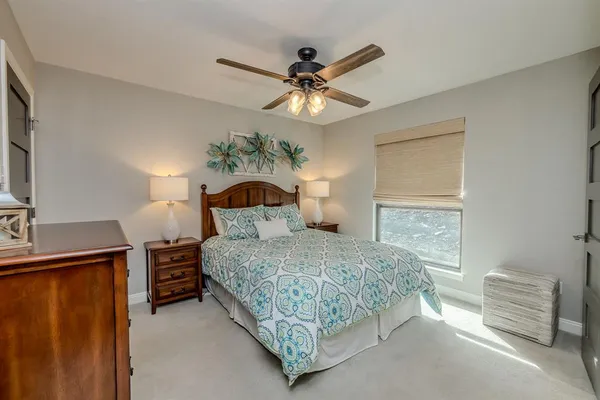 a bedroom with a bed and a dresser