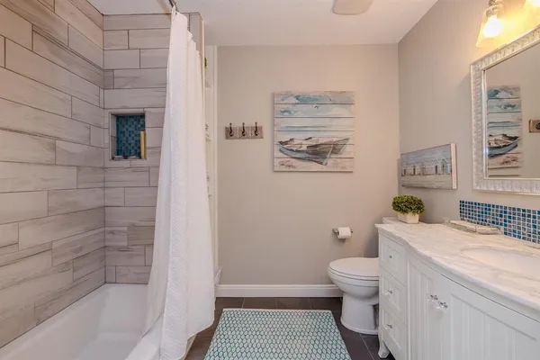 a en suite bathroom with a sink and a mirror