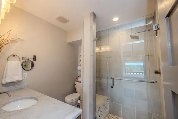 a bathroom with a sink a vanity and a mirror