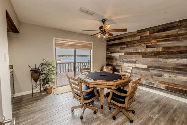 a dining room with furniture and wooden floor