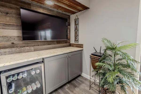 a bathroom with a granite countertop sink a toilet and mirror