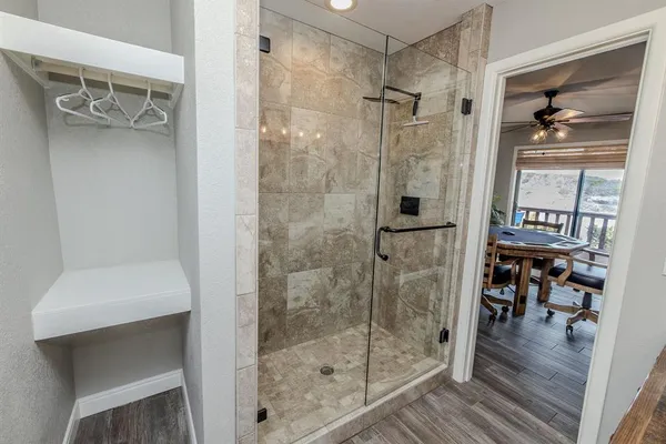 a bathroom with a glass shower door