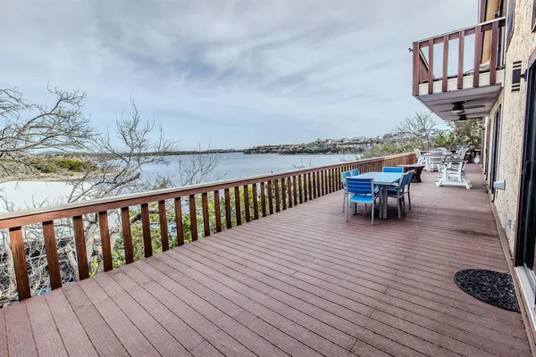 a large kitchen with kitchen island granite countertop a large counter top stainless steel appliances and cabinets