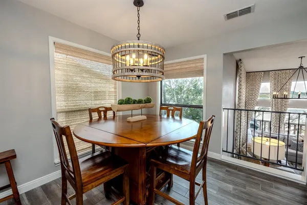a kitchen with granite countertop cabinets and white stainless steel appliances