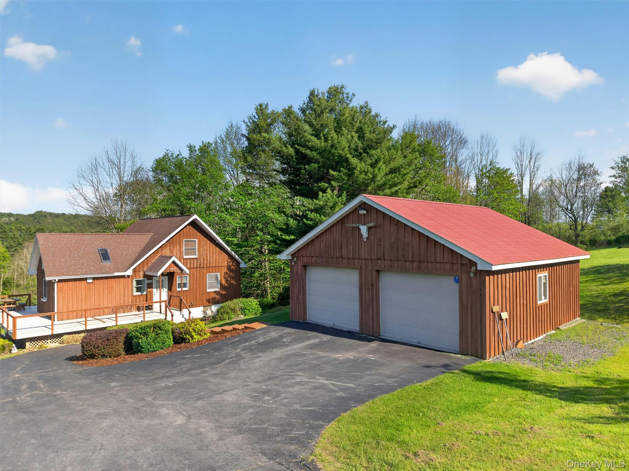 340 Hospital Road Callicoon, NY 12723 - Photo 3 of 41 a aerial view of a house with a yard and garage