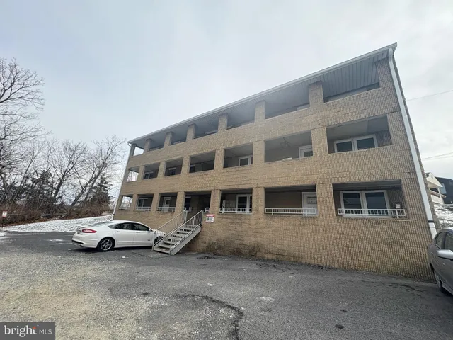 a view of a car park in front of house