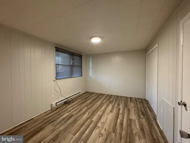 a view of wooden floor in an empty room