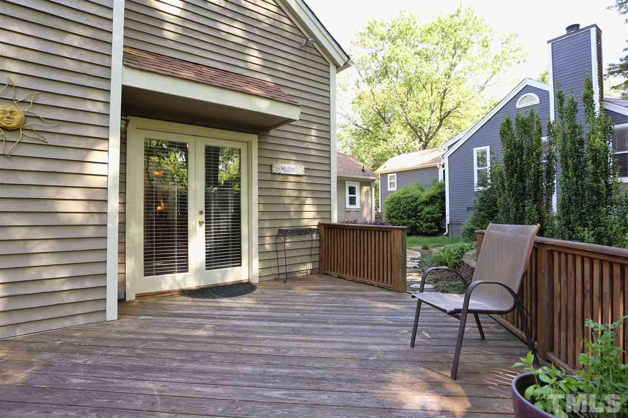 5944 Sentinel Drive Raleigh, NC 27609 - Photo 22 of 24 a view of house with backyard outdoor seating and wooden floor