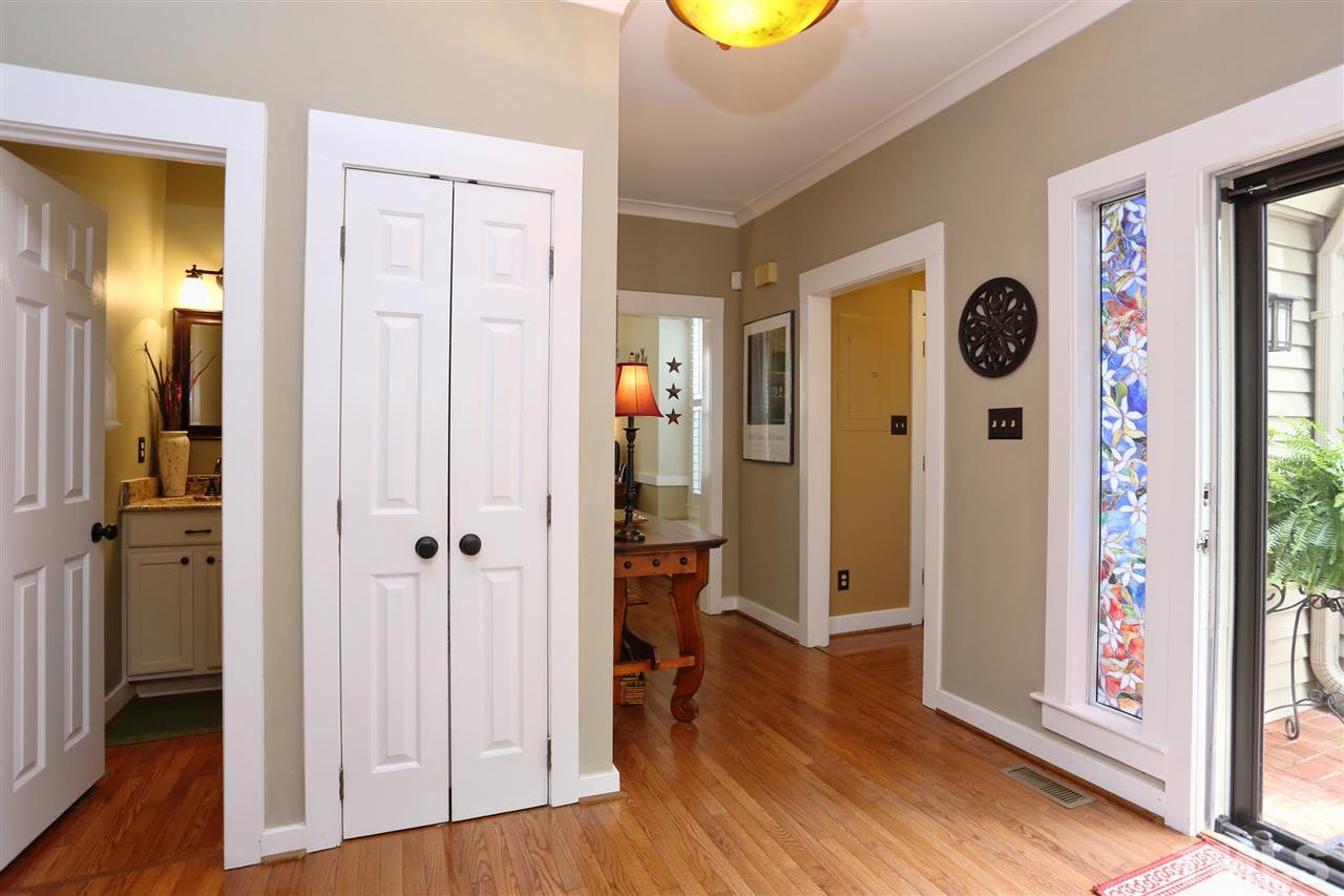 5944 Sentinel Drive Raleigh, NC 27609 - Photo 8 of 24 wooden floor with white walls