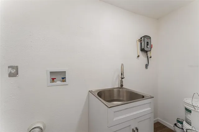 a kitchen with a sink a toilet and vanity