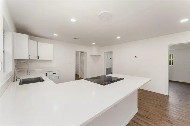 a bedroom with a bed and a sink