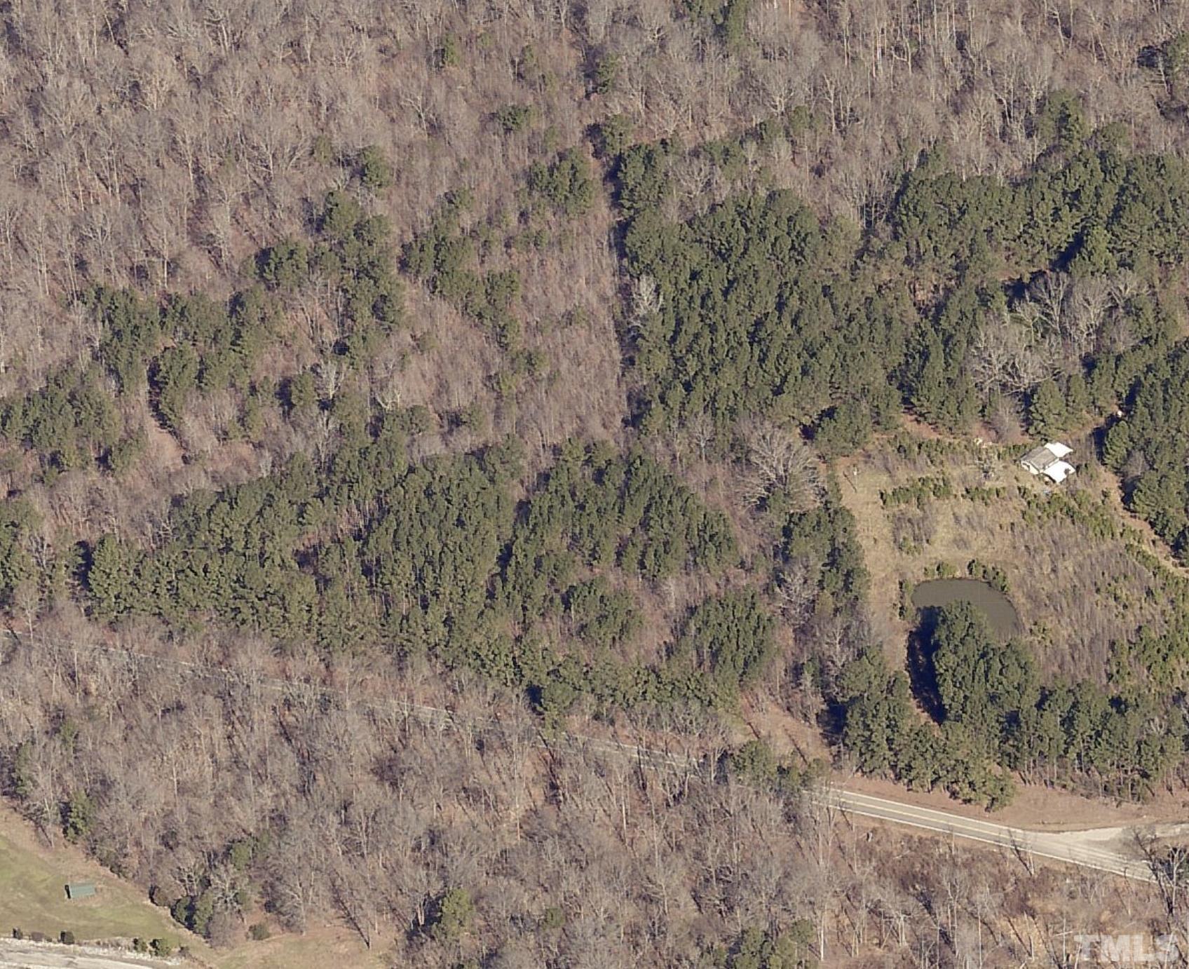 5715 Kemp Road Durham, NC 27703 - Photo 7 of 7 a view of a dry yard with large trees