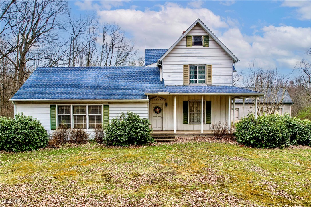 6397 King-Graves Road Fowler, OH 44418 - Photo 3 of 48 Traditional-style house with a porch, a shingled roof, and a front lawn
