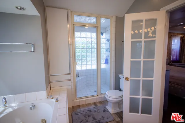 an aerial view of a house with swimming pool and garden