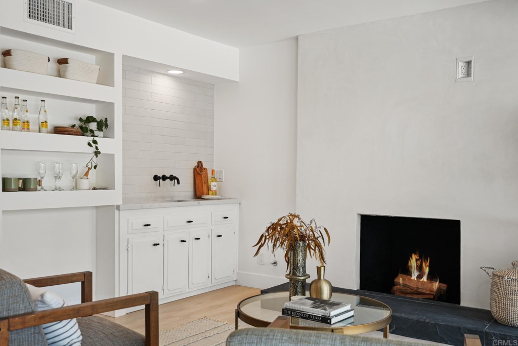 6125 Laport Street La Mesa, CA 91942 - Photo 19 of 32 a living room with furniture and a fireplace
