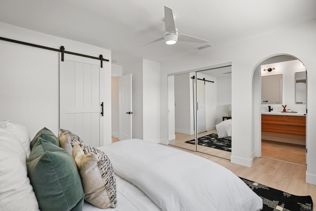 6125 Laport Street La Mesa, CA 91942 - Photo 25 of 32 a bedroom with a bed and a mirror